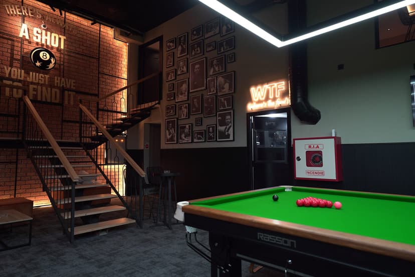 Snooker tables next to the staircase