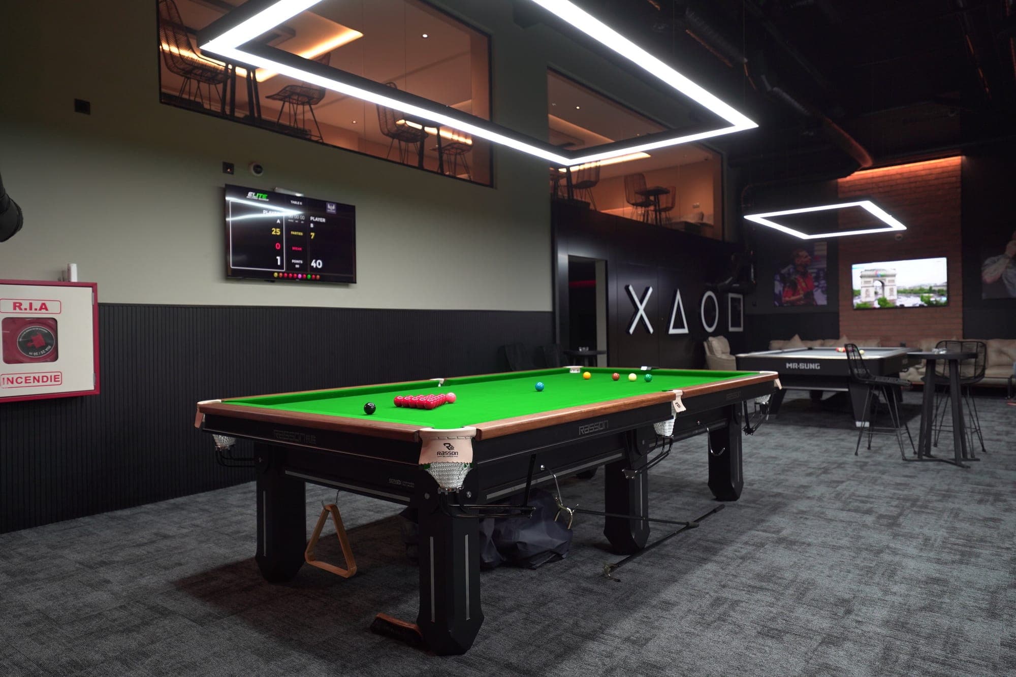 A snooker table in a spacious area of the hall