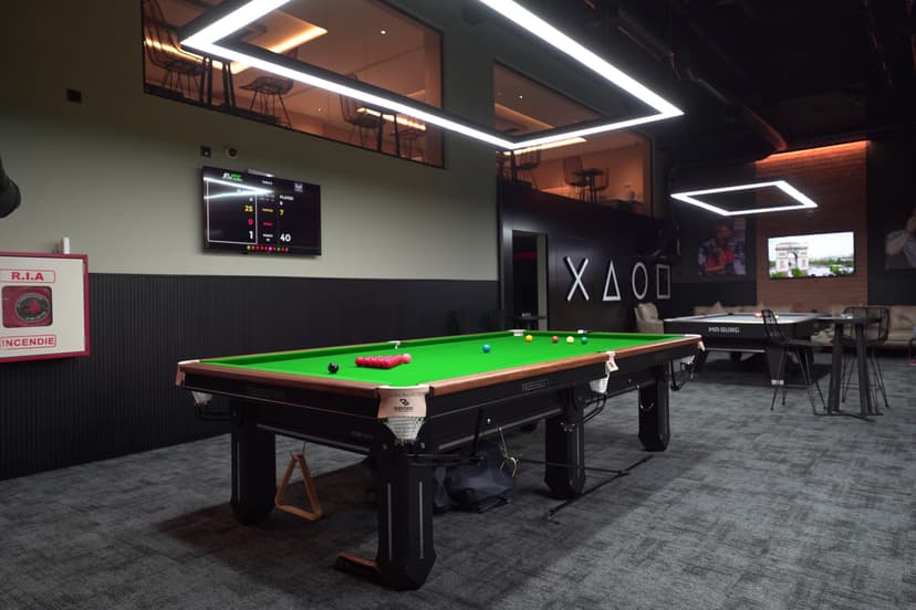 A snooker table in a spacious area of the hall