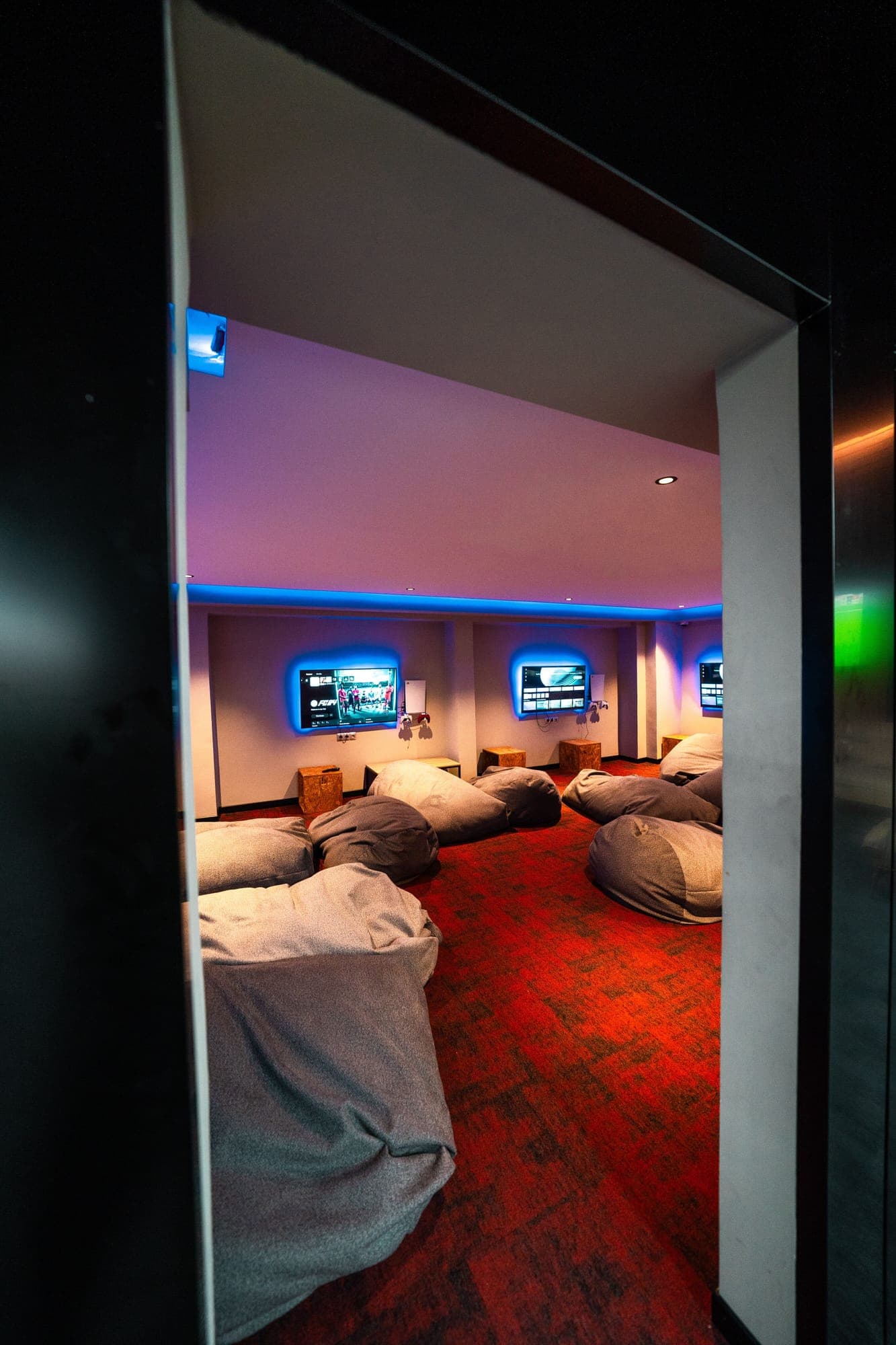 Gaming lounge with screens and bean bags